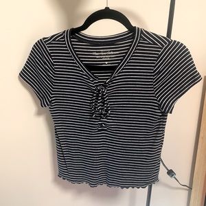 Black and white striped front tied Hollister top in size S.